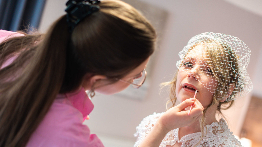 Bride getting her make up touched up